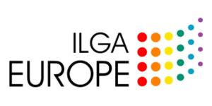 The image shows the ILGA Europe logo. The lettering "ILGA EUROPE" is designed in a clear, black font. To the right of the text are several colored dots that represent a stylized rainbow flag, running from red to orange to yellow to green to blue to purple.